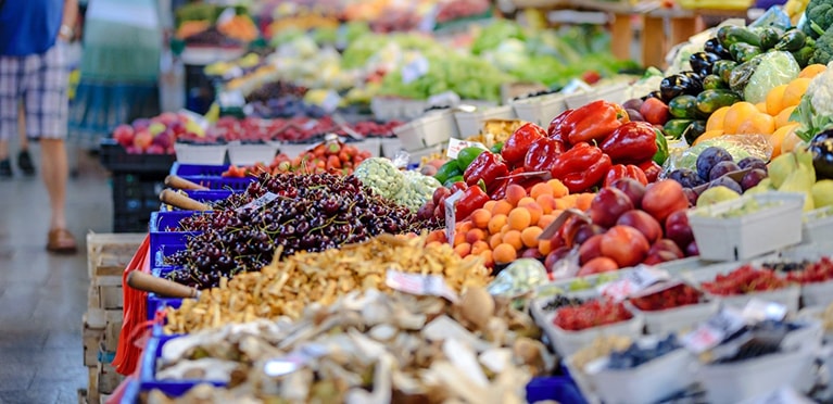 A market stall full of vegetables and fruits 