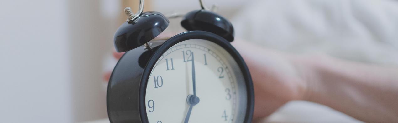 alarm clock on bedside table 