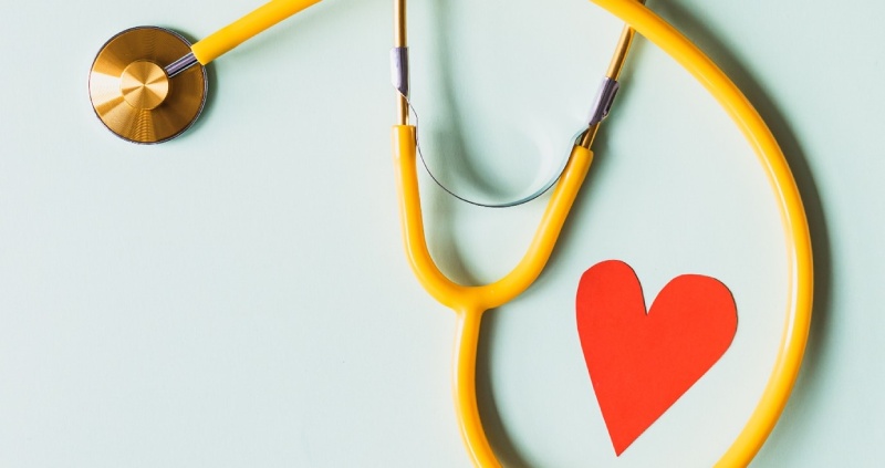 Stethoscope with a cut out paper heart 